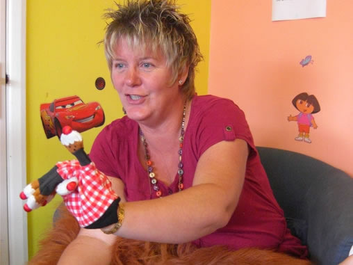 Sharing stories and songs at a Childminders' drop in session at Ashcroft and Ramridge Children's Centre