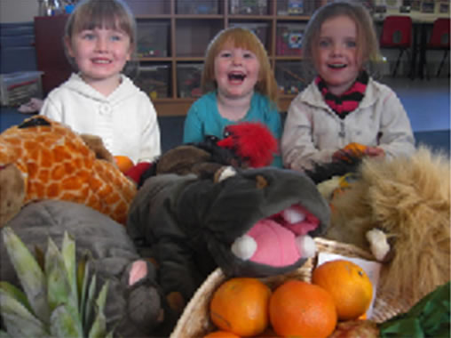 Having a laugh at a 'Handa's Surprise Family Story Day', with support from Michael